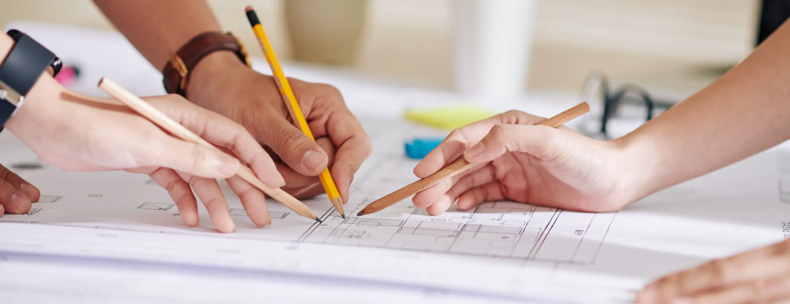 Architects reviewing blueprints